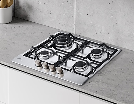 Immagine di un piano a gas installato su un piano della cucina di colore chiaro.